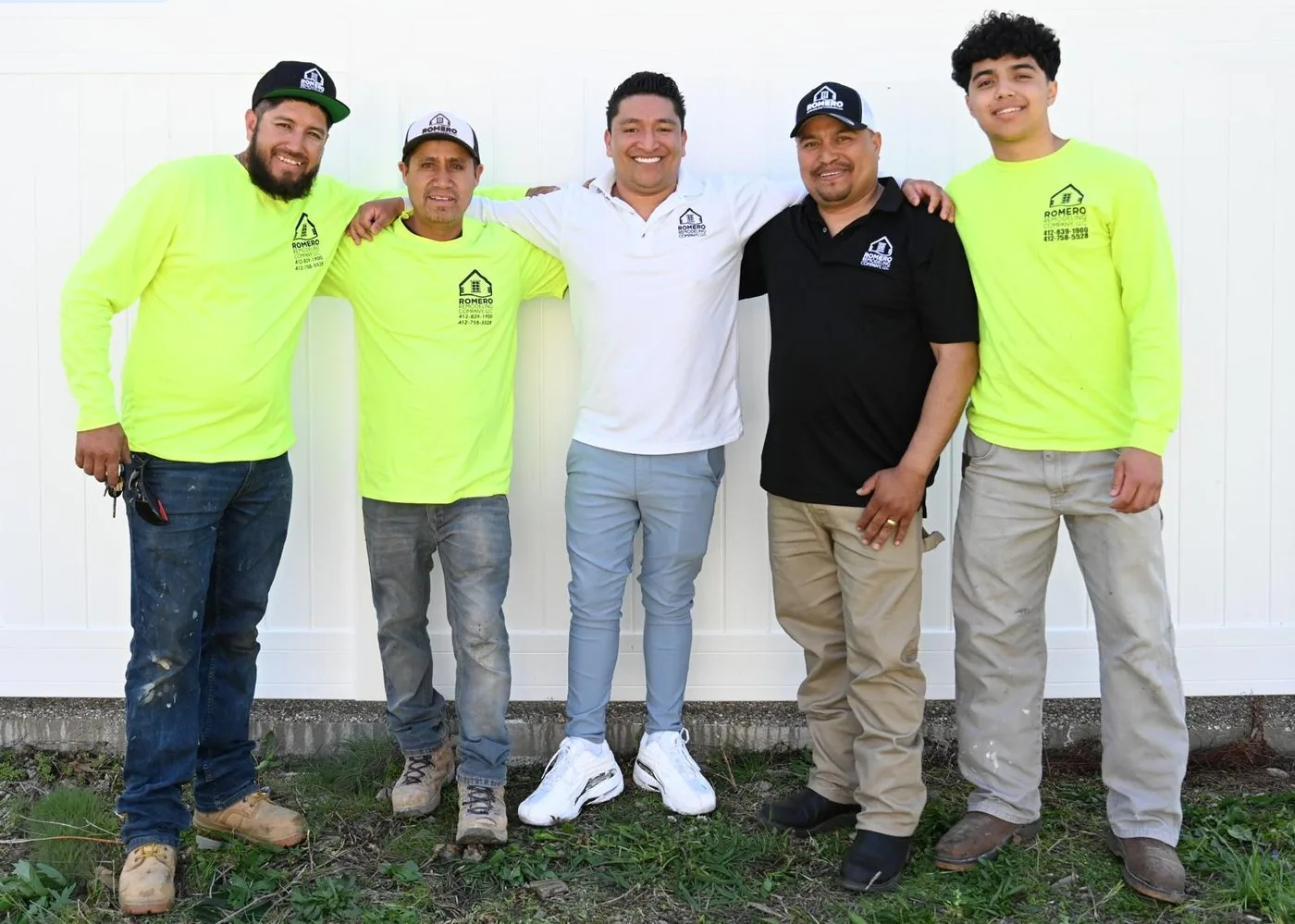 Five of the Romero Remodeling crew standing together outside a job